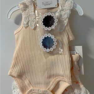 Cream Ribbed Lace-Trim Baby Onesie with Daisy Bottoms. 3 piece outfit